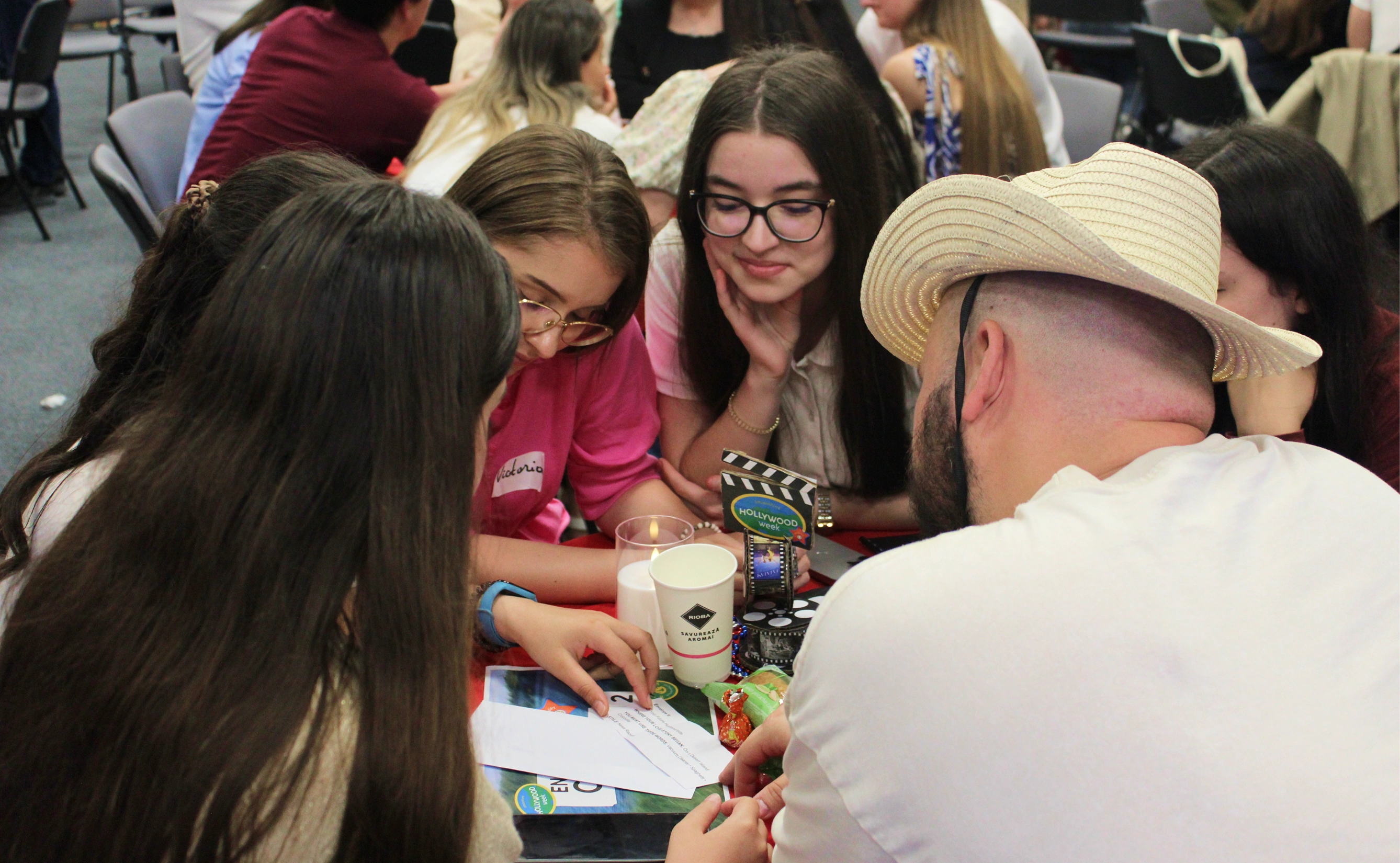 Participants sharing an English Club lesson around a table